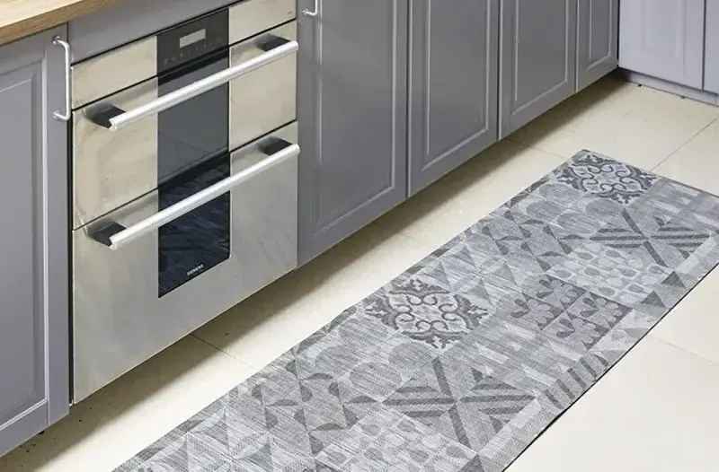 Woven vinyl texlymat runner in a kitchen hallway, hose-cleanable surface