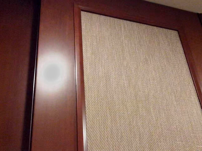 texlyweave woven vinyl laminated onto a decorative wall panel and finished in a timber frame